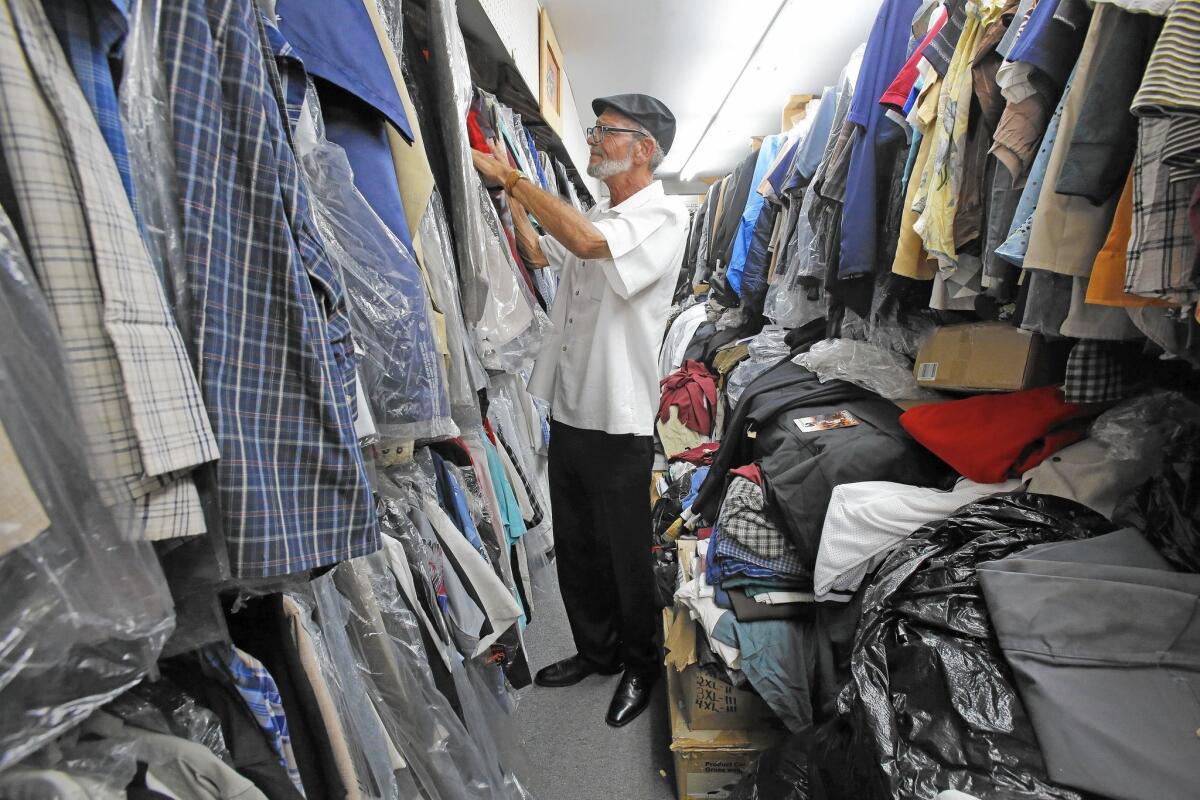Greg Thorton browses the racks at Greenspan's, a family-owned vintage clothing store in South Gate.