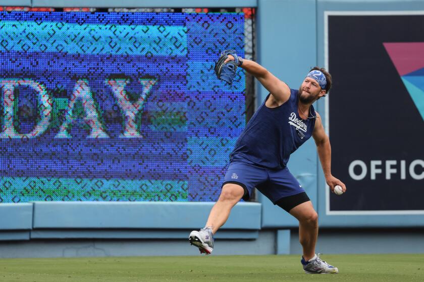 Los Angeles, CA, Sunday, June 2, 2024 - Dodgers pitcher Clayton Kershaw throws long toss while rehabbing from surgery before a game against the Colorado Rockies at Dodger Stadium. (Robert Gauthier/Los Angeles Times)