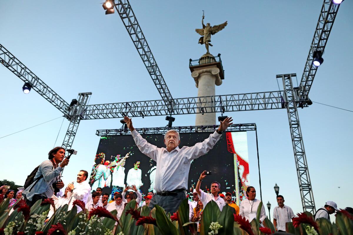Andres Manuel Lopez Obrador, the front-runner in Mexico's presidential race, greats supporters before speaking at a campaign rally in Chihuahua.