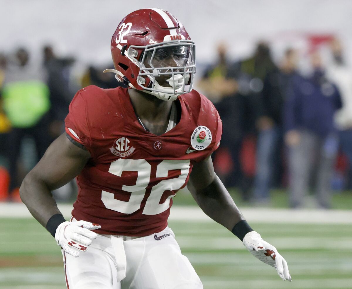 Alabama linebacker Dylan Moses (32) plays against Notre Dame during the Rose Bowl NCAA college football game in Arlington, Texas, Friday, Jan. 1, 2021. In a recent Instagram post, Moses detailed his struggles with physical problems “fighting through pain every single game” and disclosed his grandmother's death. “It’s been times I wanted to quit and times I wanted to walk away from my dreams,” he posted. (AP Photo/Ron Jenkins)