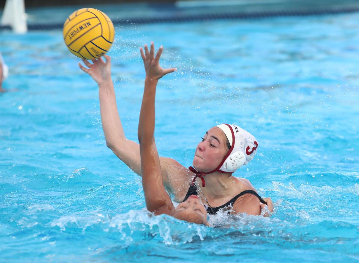 Laguna Beach's Emmy Hensley (3) takes a shot as Newport Harbor's Valery Verdugo tries to defend on Tuesday.