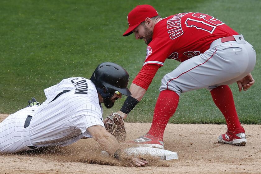 White Sox outfielder Adam Eaton steals second base against Johnny Giavotella and the Angels during a game last season.