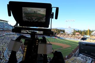 LOS ANGELES, CALIF. - AUG. 4, 2014. A television camera is trained on the field.