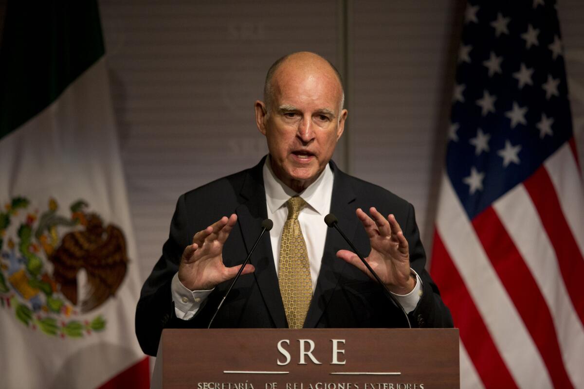 Gov. Jerry Brown answers questions during a joint press conference with Mexico's Secretary of Foreign Affairs Jose Antonio Meade in Mexico City.
