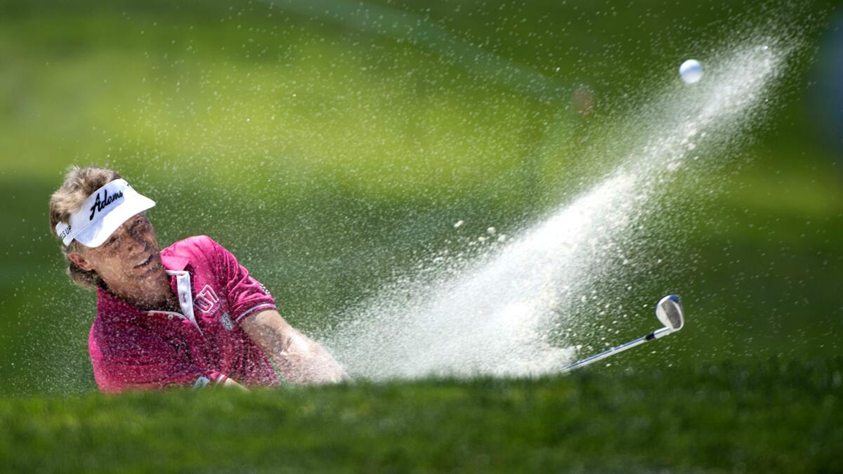 Bernhard Langer hits out of a bunker on the fifth hole during the second round of the U.S. Senior Open on Friday.
