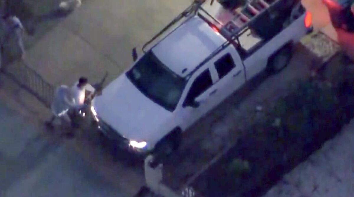 Aerial view of a man stealing a truck