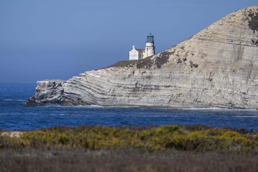 Point Conception, CA - October 03: A view of the Point Conception Lighthouse, built in 1881, Tuesday, Oct. 3, 2023. It is surrounded by The Jack and Laura Dangermond Preserve, which is 24,329 acres of land the Nature Conservancy purchased near Lompoc Tuesday, Oct. 3, 2023. The Nature Conservancy purchased 24,329 acres of land in 2017 in the area from a New England investment firm to protect it from development. "Our findings will provide glimpses into California's coastal future." Sometimes referred to as the "elbow of California," it exists as the demarcation between the state's distinct southern and northern ecosystems, a place where the cold Pacific current meets the warmer waters sweeping up from Baja California. It is owned by the Nature Conservancy, which is collaborating with NOAA, NASA, and other federal agencies on dozens of ongoing research projects, including the recent demolition of concrete diversions that were preventing federally endangered steelhead salmon from reaching ancient spawning grounds. (Allen J. Schaben / Los Angeles Times)