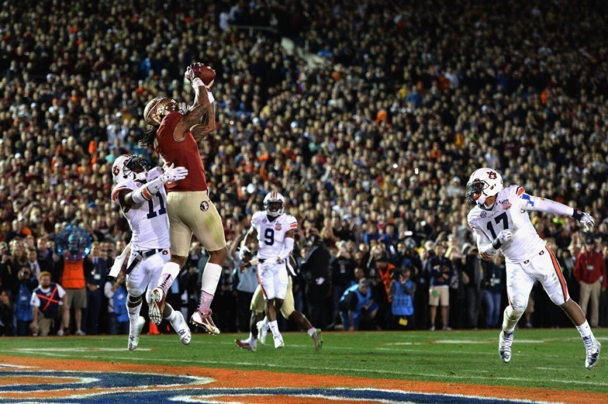 Florida State's Kelvin Benjamin catches the touchdown pass that cost Mark Skiba $50,000.