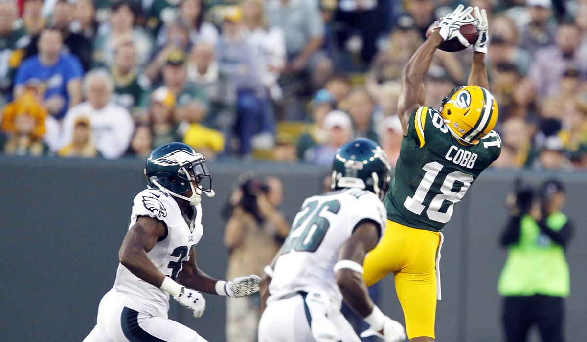 Green Bay Packers' Randall Cobb goes up for the catch during a preseason game against the Philadelphia Eagles on Saturday. Cobb left the field after the play.