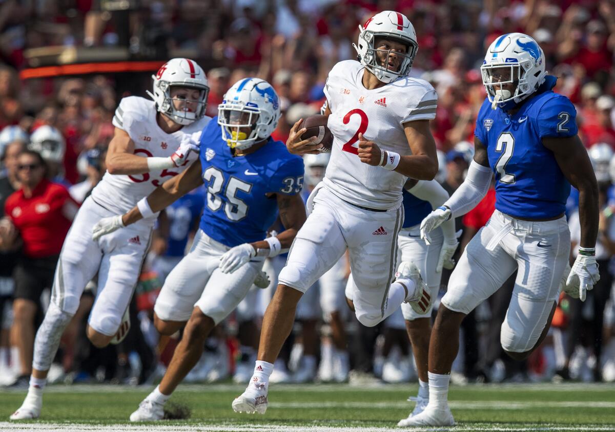 Nebraska quarterback Adrian Martinez (2) rushes the ball down to the Buffalo 2-yard line to help set up Nebraska's first touchdown in the second quarter of an NCAA college football game Saturday, Sept. 11, 2021, in Lincoln, Neb. (Francis Gardler/Lincoln Journal Star via AP)