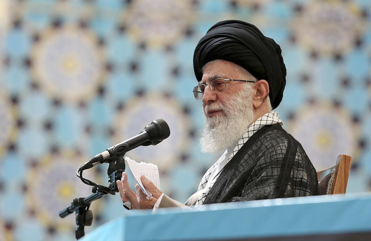 In this picture released by the official website of the office of the Iranian supreme leader, Supreme Leader Ayatollah Ali Khamenei speaks at a ceremony marking the 25th anniversary of the death of the late Ayatollah Khomeini at his shrine just outside Tehran on Wednesday.