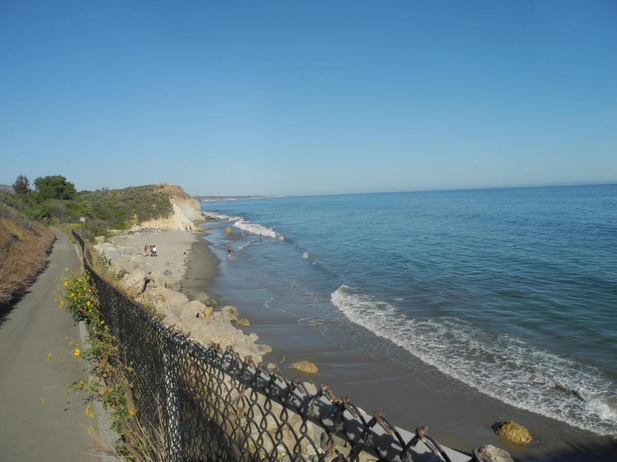 During their hike on the Aniso Trail from Refugio State Beach to El Capitan State Beach, the Florez family saw a stretch of sand where people were enjoying the beach, May 20, 2017. (Denise Florez / Los Angeles Times)