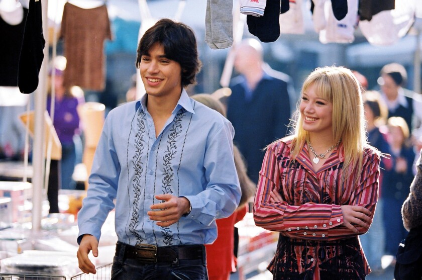 Hilary Duff, right, in 2003's "The Lizzie McGuire Movie." Duff will reprise the role in the Disney+ sequel series to "Lizzie McGuire," announced Friday at the D23 Expo in Anaheim.