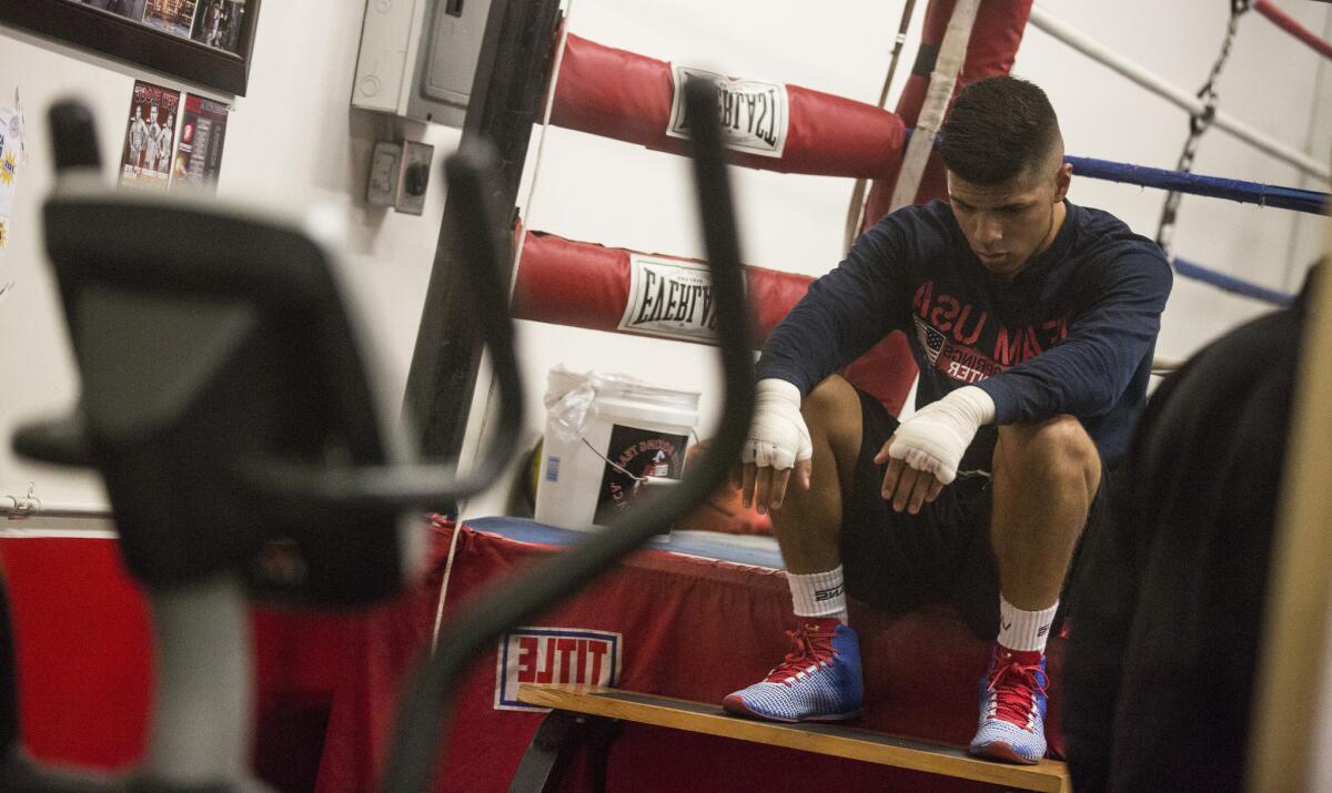 Carlos Balderas rests after training session in his hometown gym in Santa Maria.