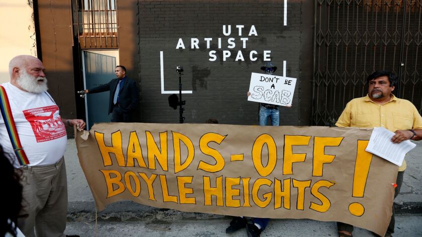 Anti-gentrification activists protest an art show in Boyle Heights on July 15.