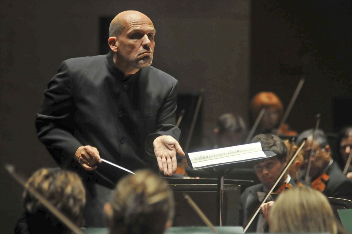 FILE - In this Sept. 29, 2011, file photo, Jaap van Zweden conducts the Dallas Symphony Orchestra in Dallas. Van Zweden will leave the New York Philharmonic at the end of the 2023-24 season after six years as music director, the shortest tenure of anyone in a half-century. Van Zweden informed the orchestra at the end of a rehearsal Wednesday, Sept. 15, 2021, two days before the orchestra resumes performances after an 18-month stoppage. (Mark M. Hancock/The Dallas Morning News via AP, File)