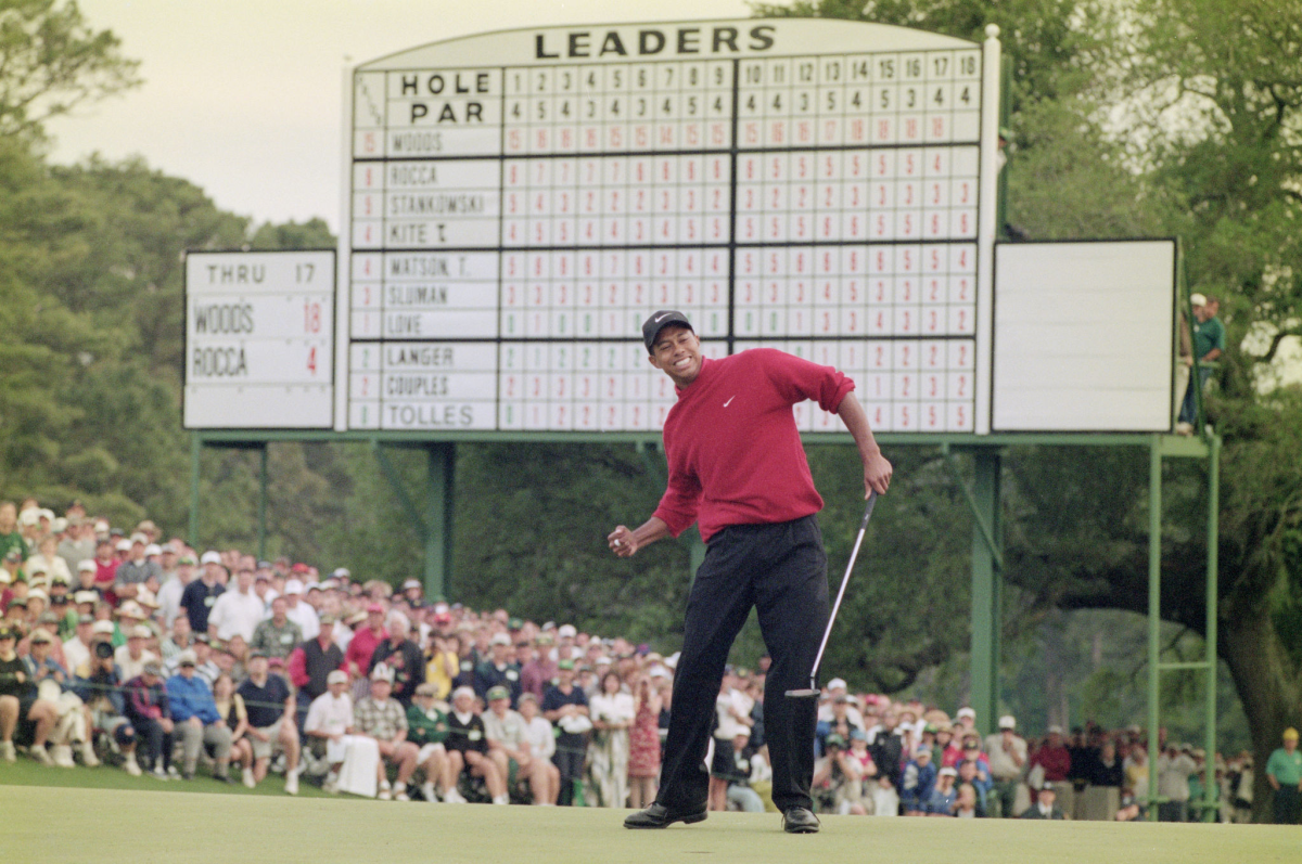 Tiger Woods celebrates after sinking a four-foot putt to win the Masters on April 13, 1997.