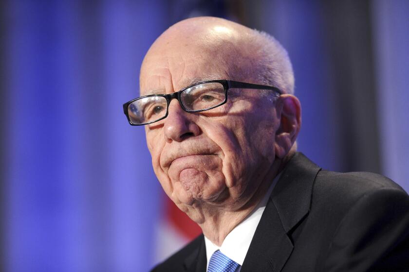 FILE - In this Oct. 14, 2011, file photo, News Corp. CEO Rupert Murdoch delivers a keynote address at the National Summit on Education Reform in San Francisco. Murdoch stirs mixed feelings in Britain, where he transformed the media over half a century. U.K. journalists and politicians are both hailing and reviling the 92-year-old mogul after he announced he was stepping down as leader of his media empire. (AP Photo/Noah Berger, File)