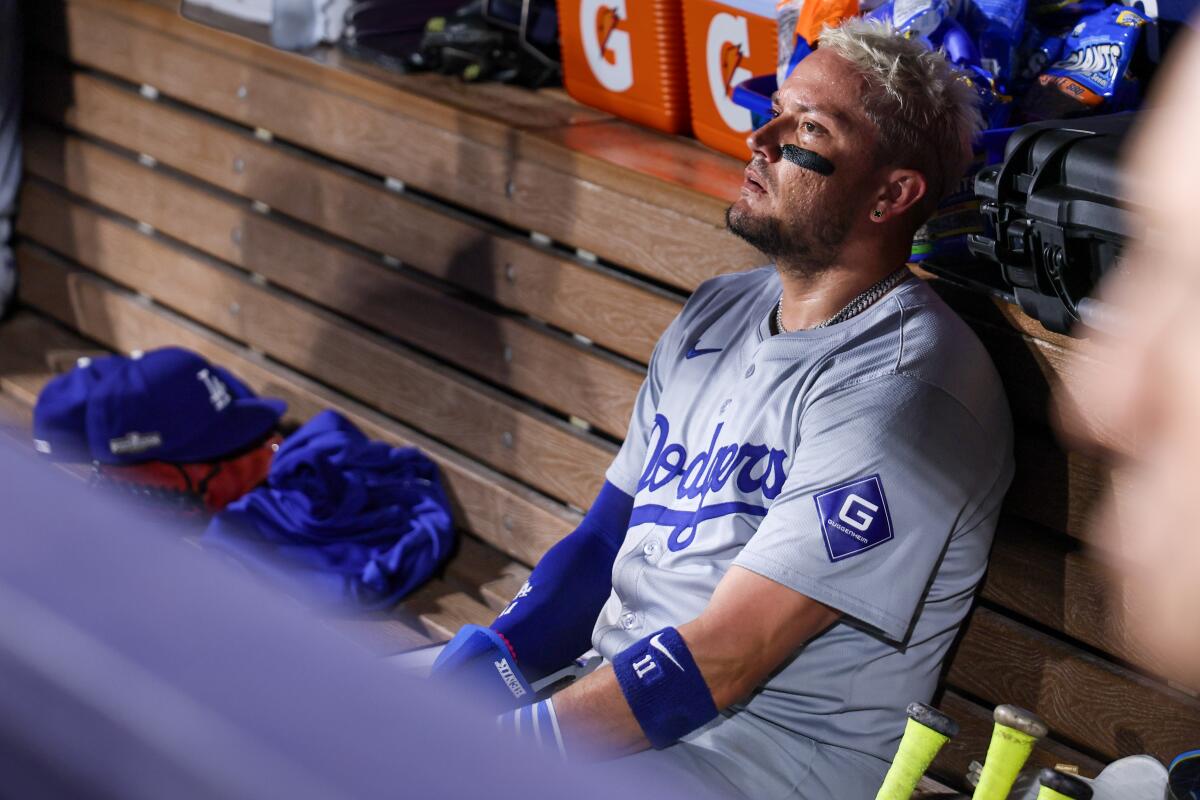 Dodgers shortstop Miguel Rojas sits in the dugout after leaving Game 3 of the NLDS against the San Diego Padres.