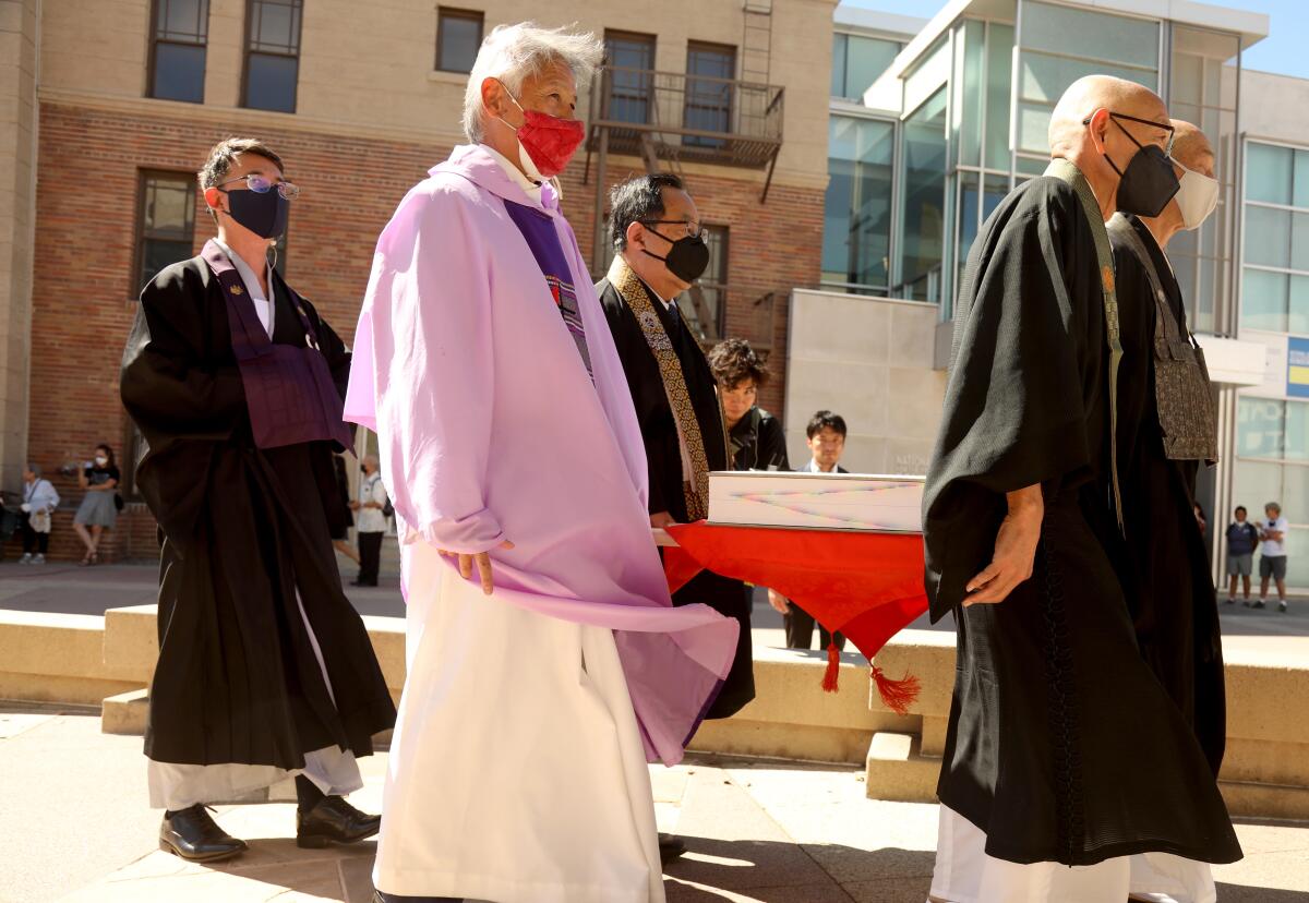 Spiritual leaders carry the sacred book Ireicho