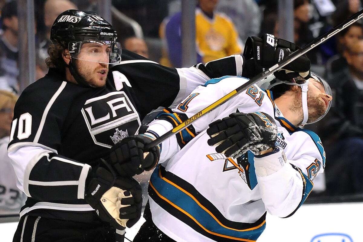 Kings center Mike Richards shoves Sharks forward T.J. Galiardi in the face during the 2013 playoffs.