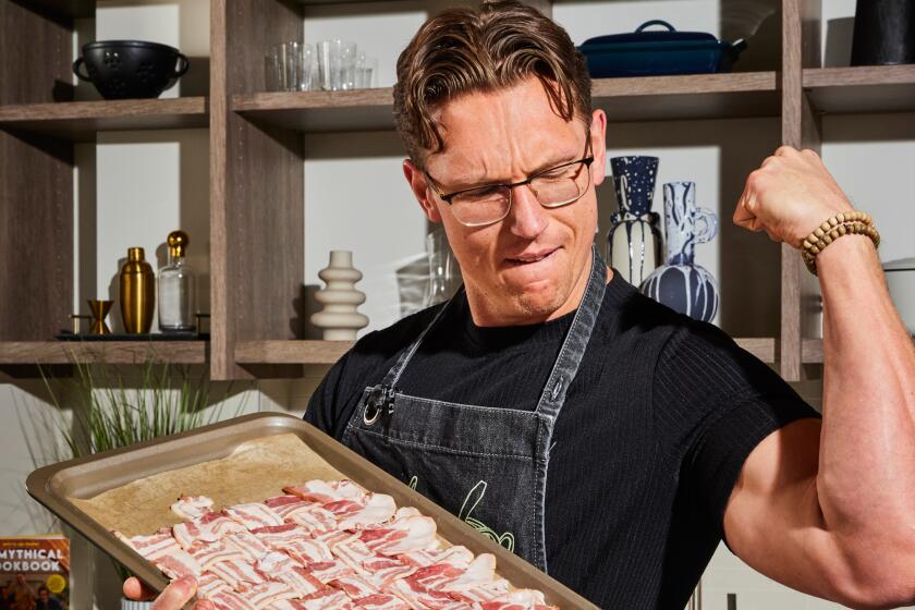 Chef Josh Scherer poses with latticed bacon.