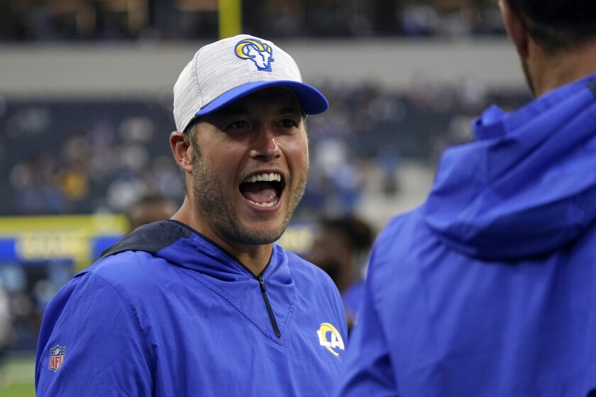 Rams quarterback Matthew Stafford talks on the sidelines during warmups.