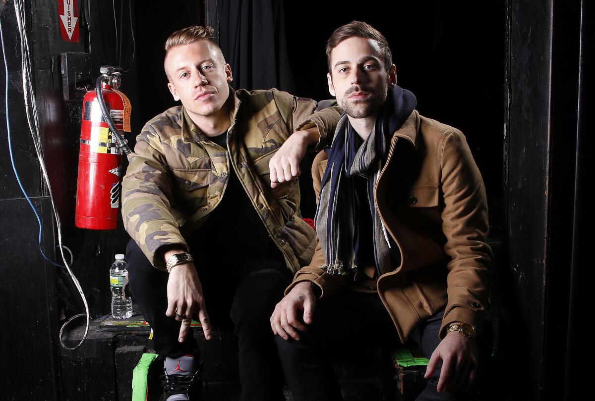 Ben Haggerty, better known by his stage name Macklemore, left, and his producer, Ryan Lewis, are among the performers announced for the Grammy Award nominations concert Dec. 6 in Los Angeles, along with Drake, Robin Thicke and Keith Urban.