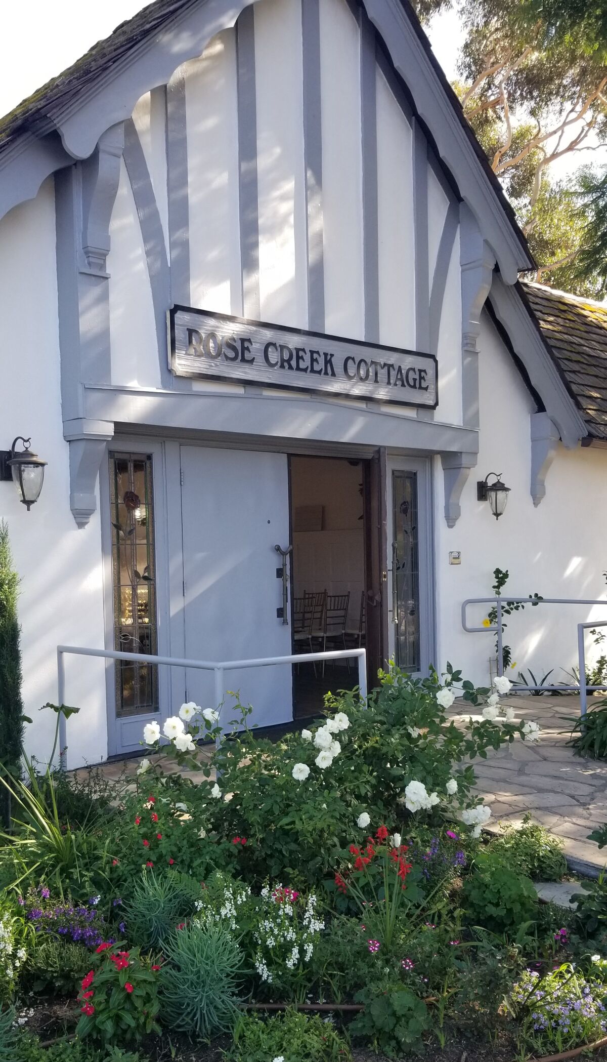 The front of Rose Creek Cottage has been re-painted white with blue-gray accents. Operators Frank and Letizia Gaxiola’s love for nature and plants has been incorporated into every corner of the venue.