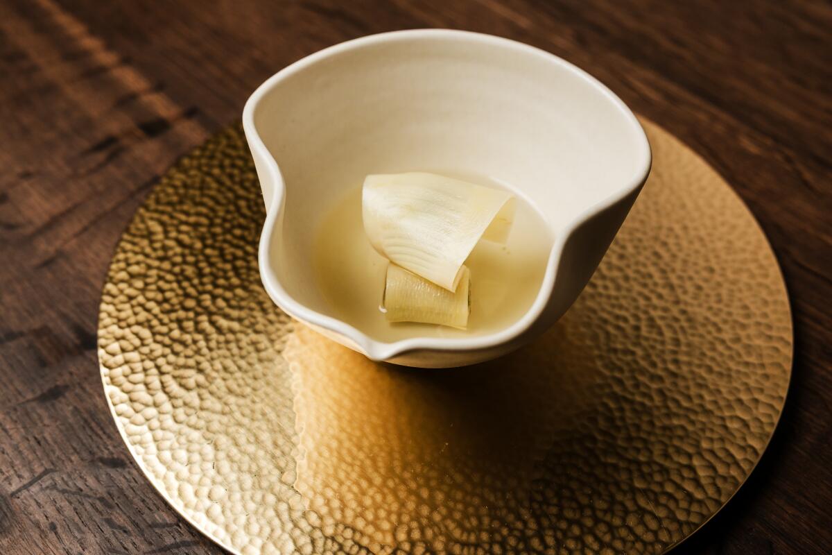 San Francisco, CA - May 20: fresh bamboo with bamboo fungi, chicken consomme at Benu Restaurant on Tuesday, May 20, 2025 in San Francisco, CA. (Carolyn Fong / For The Times)