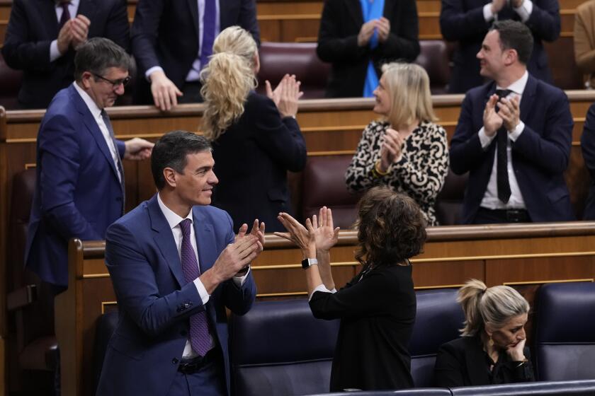 From left to right and foreground, Spain's Socialist Prime Minister Pedro Sanchez, Spain's Deputy Prime Minister and Ministry of Finance Maria Jesus Montero and Spain's second Deputy Prime Minister and Labour Minister Yolanda Diaz at the Spanish Parliament in Madrid, Spain, Thursday, March 14, 2024. Spain’s Parliament on Thursday has approved a controversial amnesty bill aimed at forgiving crimes — both proved and alleged — committed by Catalan separatists during a chaotic attempt to hold an independence referendum six years ago. (AP Photo/Manu Fernandez)