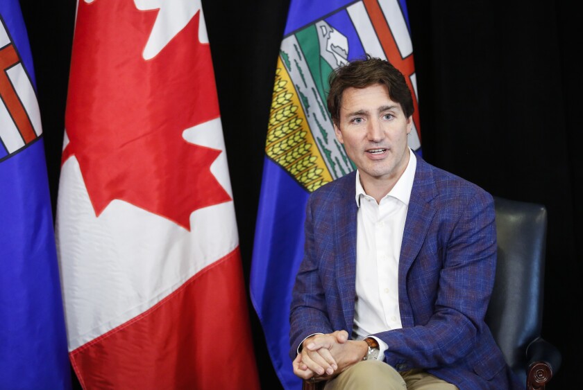 Canadian Prime Minister Justin Trudeau speaks as he meets with Alberta Premier Jason Kenney in Calgary, Alberta, Wednesday, July 7, 2021. (Jeff McIntosh/The Canadian Press via AP)