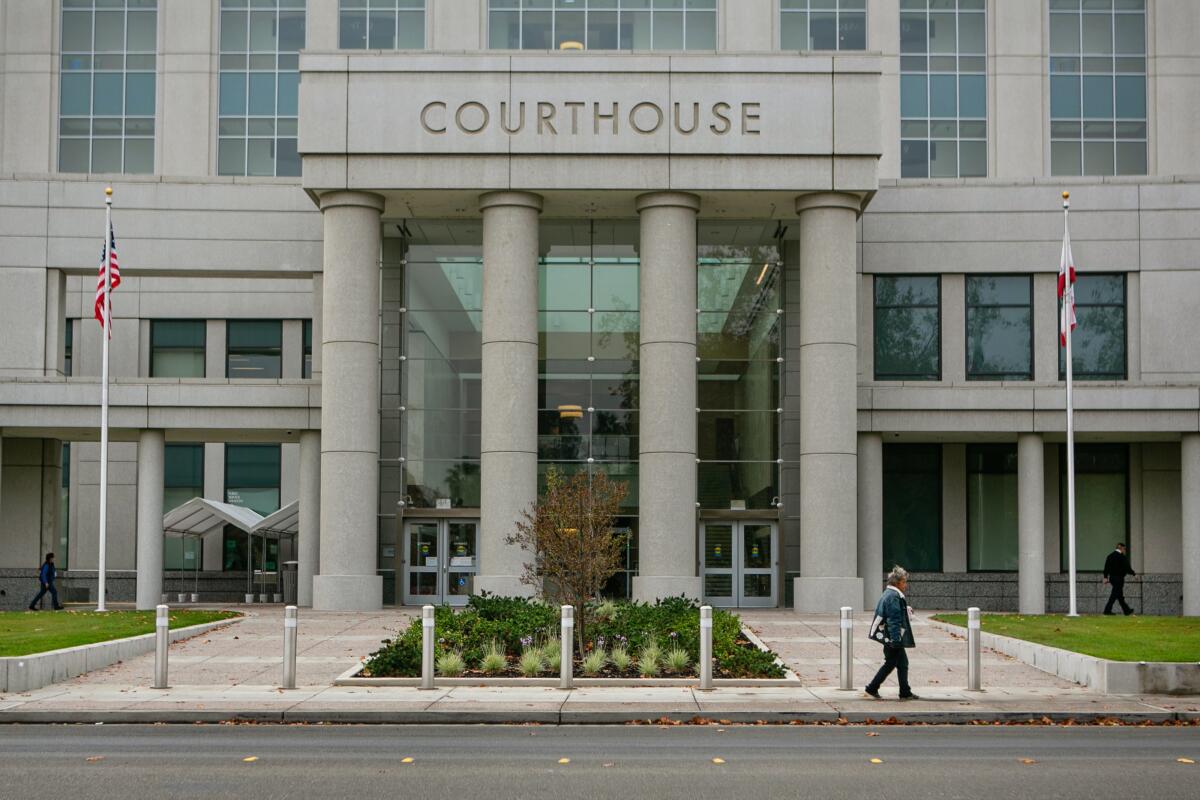 A person walks by the Superior Court of Yolo County.