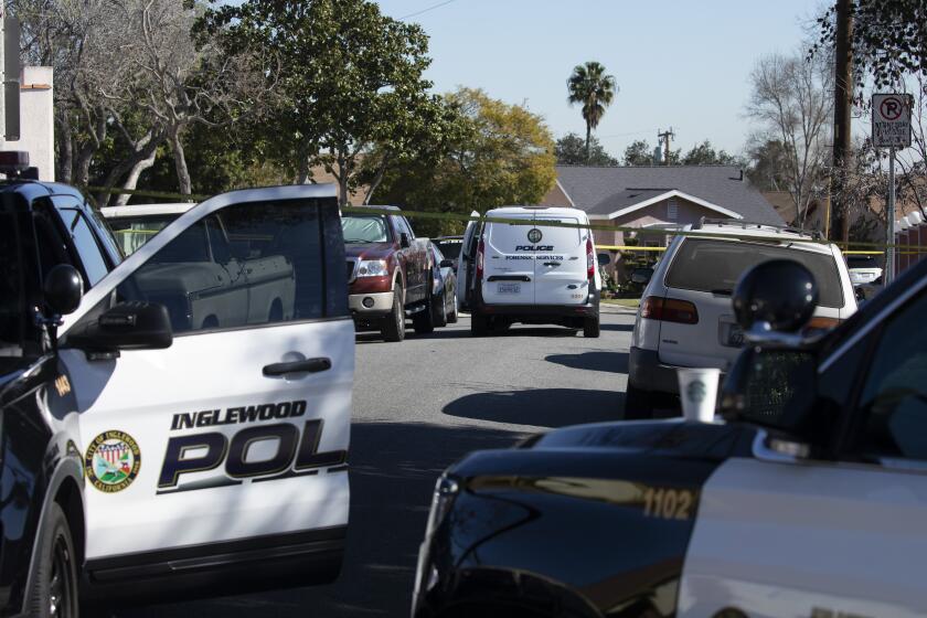 INGLEWOOD, CA - JANUARY 23: Police block Hargrave Street near Park Avenue in Inglewood on Sunday, Jan. 23, 2022 where an early morning shooting at a house party killed four people and wounded a fifth. (Myung J. Chun / Los Angeles Times)