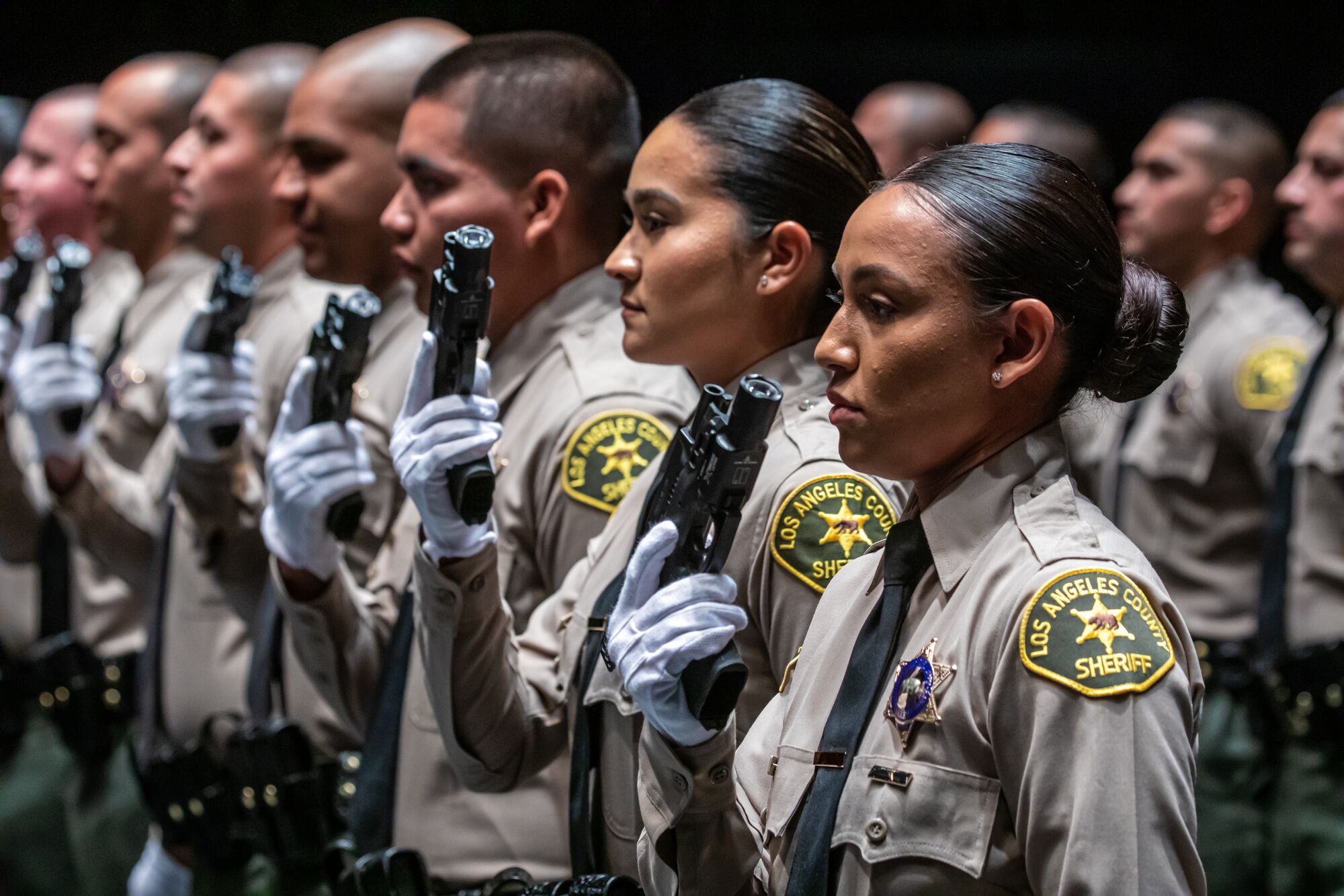 Los Angeles County Sheriff Academy Class 464 graduate Yadira Fernandez, foreground and other graduates, 