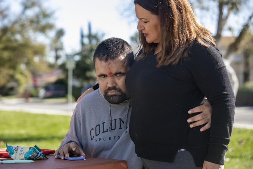 CHATSWORTH, CA-JANUARY 25,2024:Goyo Topete, 30, who is autistic, and his mother Laura, are photographed during an outing to Mason Park in Chatsworth. Goyo lives at Elwyn-Mayall, a home in Northridge for autistic adults. He is one of two males, both autistic adults, who were allegedly abused by one of the staff members (who has since been fired) at the home. (Note:The bruises on Goyo's face are self-inflicted). (Mel Melcon / Los Angeles Times)