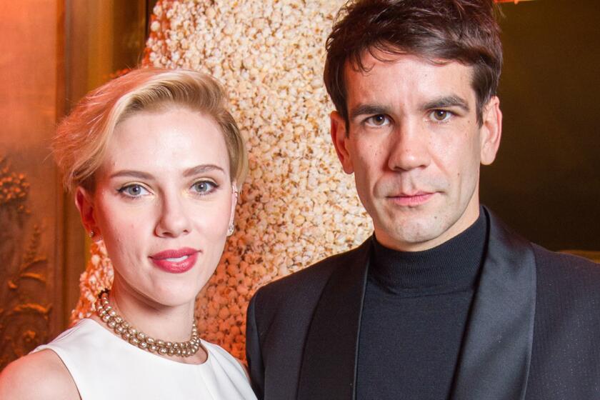 Scarlett Johansson and Romain Dauriac in December at the grand opening of Yummy Pop, their gourmet popcorn store in Paris.