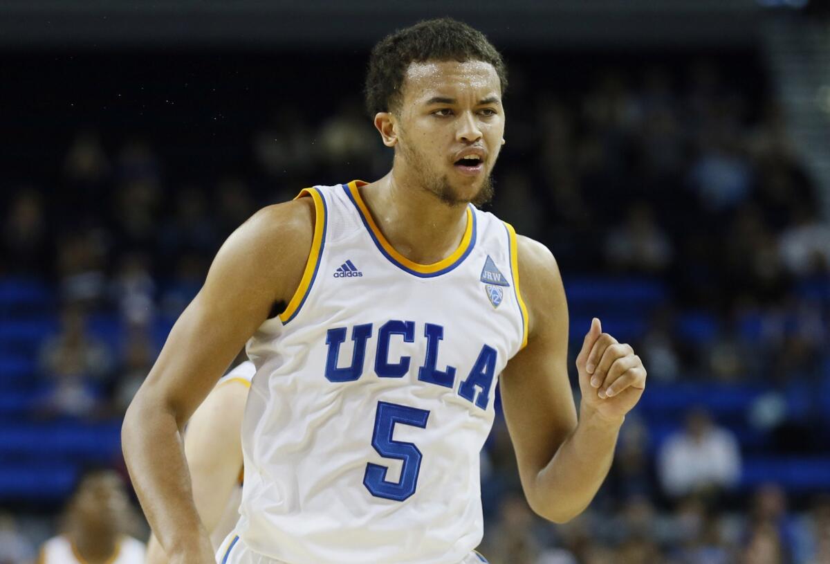 UCLA's Kyle Anderson celebrates after hitting a three-pointer at the first-half buzzer during the Bruins' 83-60 win over Weber State on Sunday.