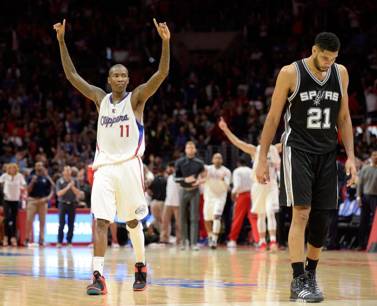 Jamal Crawford, left, celebrates near San Antonio's Tim Duncan on Thursday night at Staples Center.