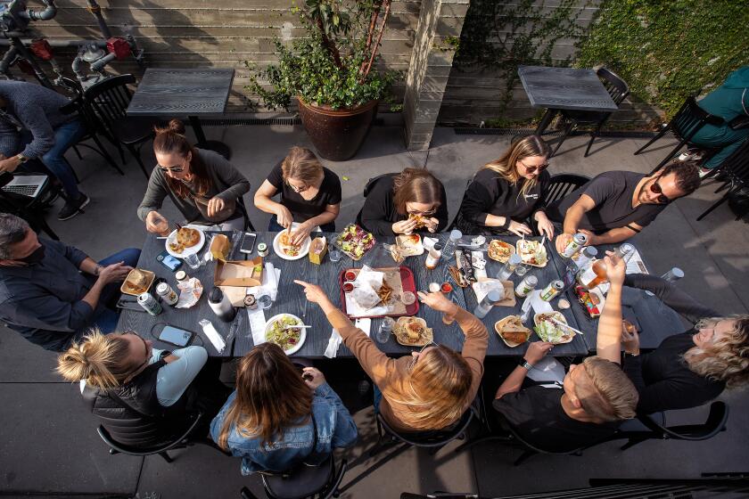 CULVER CITY, CA - November 19, 2021: People enjoy their lunch while eating in the back patio at Citizen Public Market, Culver City's newest food hall. (Mel Melcon / Los Angeles Times)
