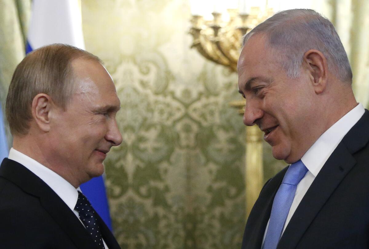Russian President Vladimir Putin, left, welcomes Israeli Prime Minister Benjamin Netanyahu during a meeting at the Kremlin in Moscow on June 7, 2016.