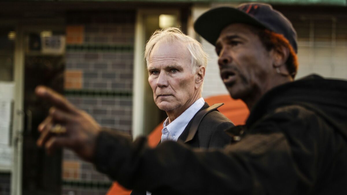 U.N. Special Rapporteur Philip Alston tours Los Angeles' skid row with General Dogon on Dec. 5.