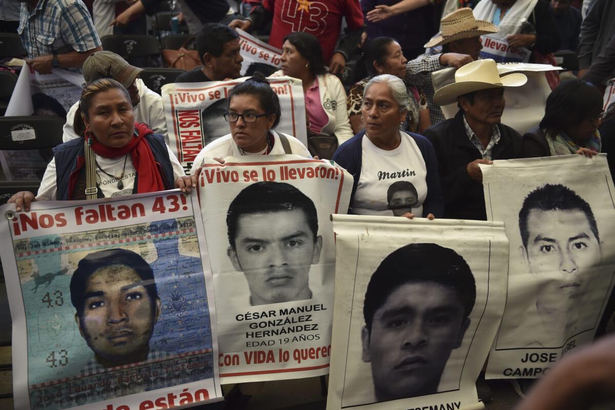 Parents and other relatives of the 43 missing students from the Ayotzinapa teachers school attend the reading of the final report from the Interdisciplinary Group of Independent Experts in Mexico City on Sunday.