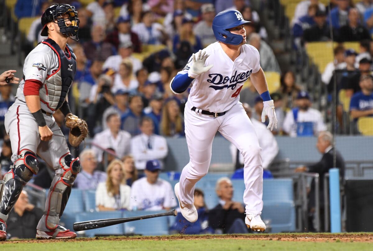 Dodgers second baseman Gavin Lux hits a solo home run against the Nationals during Game 1 of the National League Division Series.