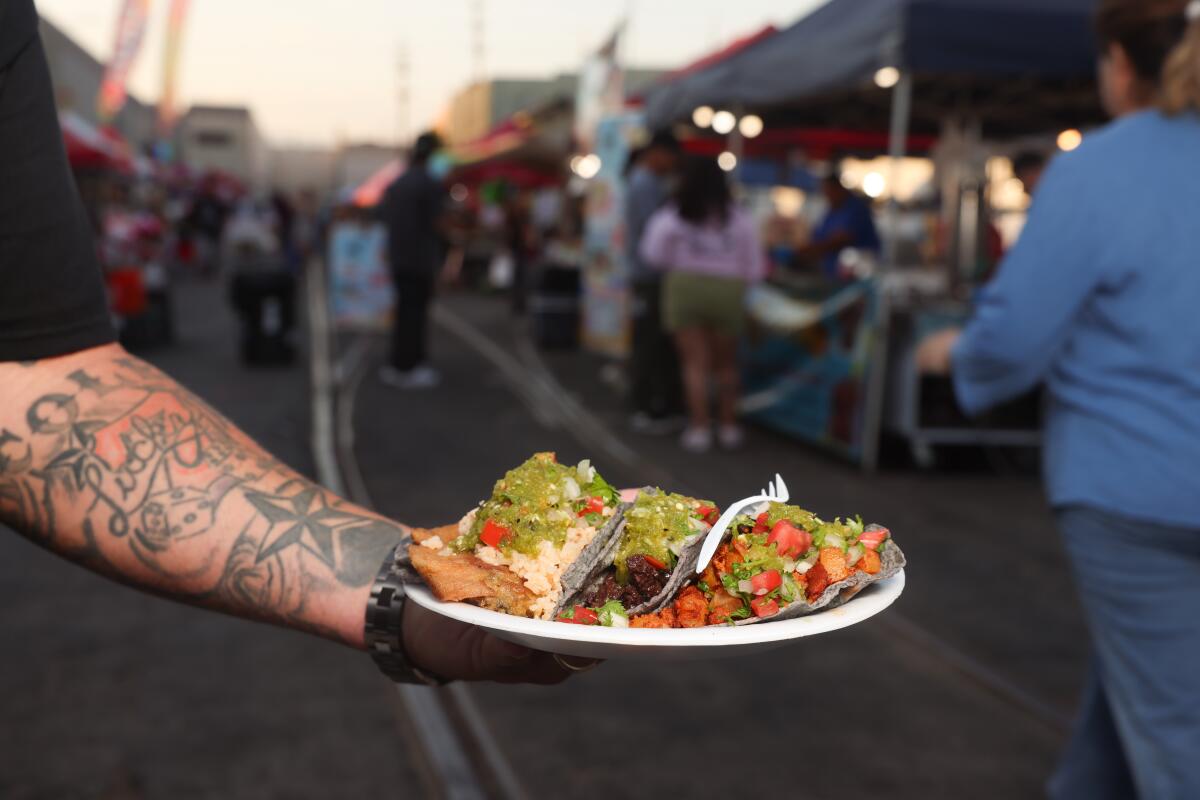 A plate of tacos is displayed at the Industrial Downtown Night Market.