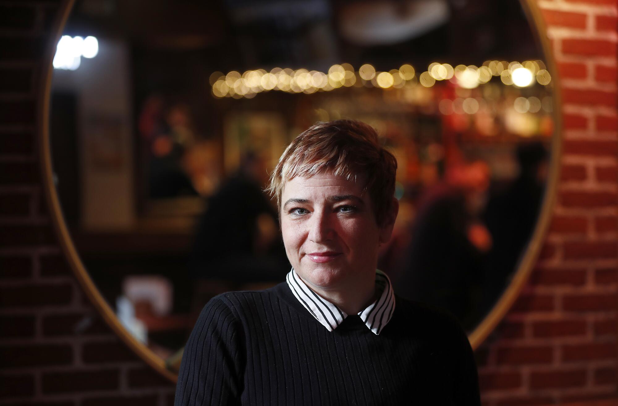 Kari Kuelzer is the owner of Grendel's Den restaurant near the campus of Harvard University.