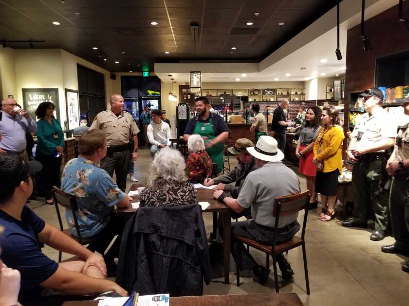 Lemon Grove Sheriff's Department Lt. Mike Rand spoke to residents at a Lemon Grove Starbucks last week about plans to go high-tech and use video cameras in parts of the city to help law enforcement keep an eye on the community.