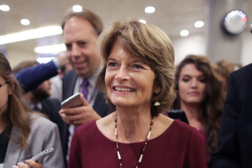 WASHINGTON, DC - OCTOBER 02: Sen. Lisa Murkowski (R-AK) (C) talks with reporters as she heads for the weekly Senate Republican policy luncheon at the U.S. Capitol October 02, 2018 in Washington, DC. Senate GOP leaders agreed last week with the Judiciary Committee to allow the FBI to conduct a one-week investigation into sexual assault allegations against Supreme Court nominee Judge Brett Kavanaugh before the Senate votes on his confirmation. (Photo by Chip Somodevilla/Getty Images) ** OUTS - ELSENT, FPG, CM - OUTS * NM, PH, VA if sourced by CT, LA or MoD **