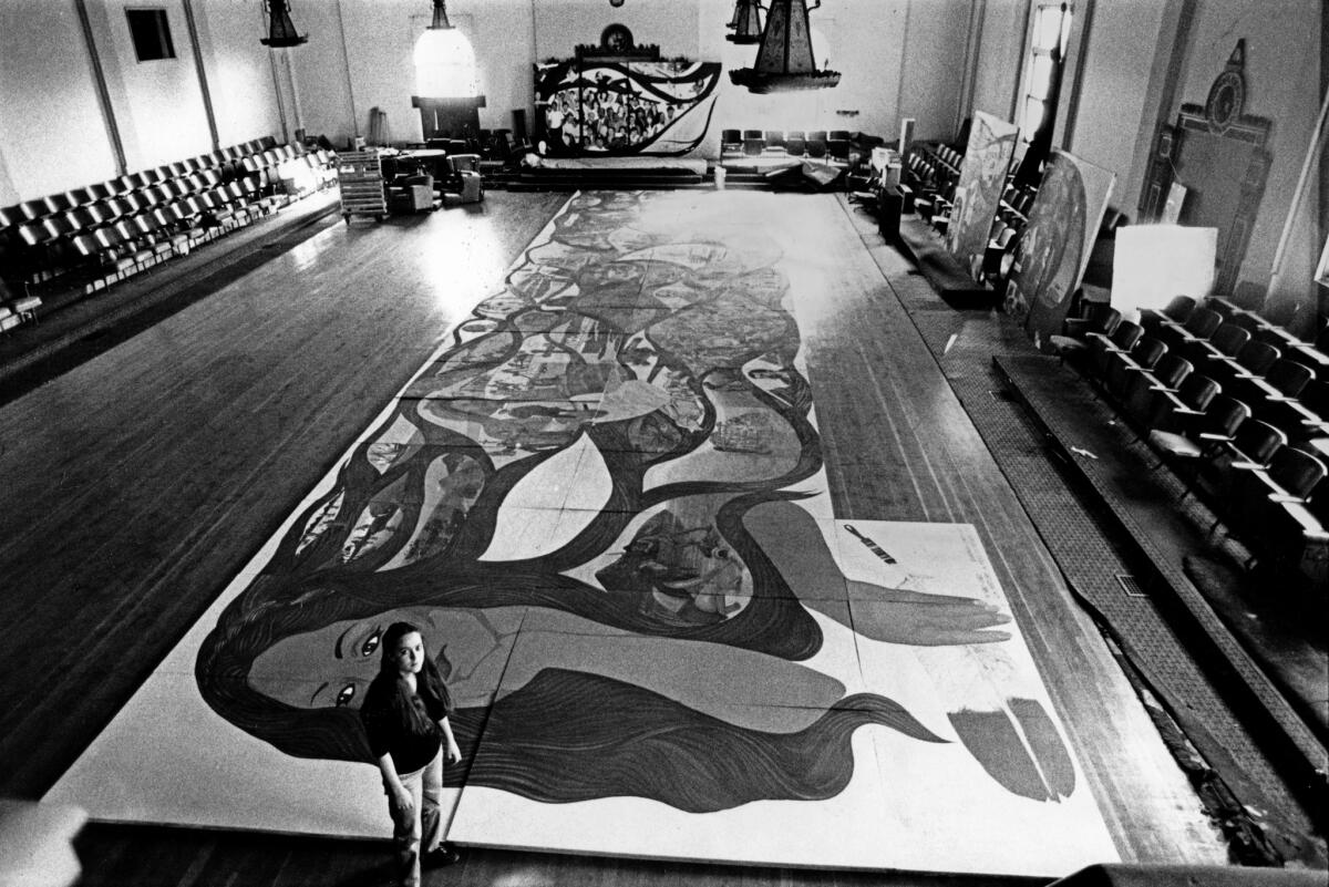 Barbara Carrasco is seen with her mural in 1983.