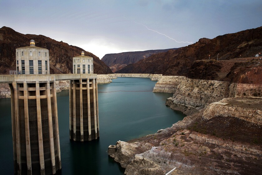 In this July 28, 2014, file photo, lightning strikes over Lake Mead near Hoover Dam that impounds Colorado River water at the Lake Mead National Recreation Area in Arizona. Lawmakers in Congress have introduced a bill that would pump tens of billions of dollars into fixing and upgrading the country's dams. The bill, introduced by Democratic U.S. Rep. Annie Kuster of New Hampshire, proposed to spend nearly $26 billion to make the repairs that would enhance safety and increase the power generation capacity of the country's dams.(AP Photo/John Locher, File)
